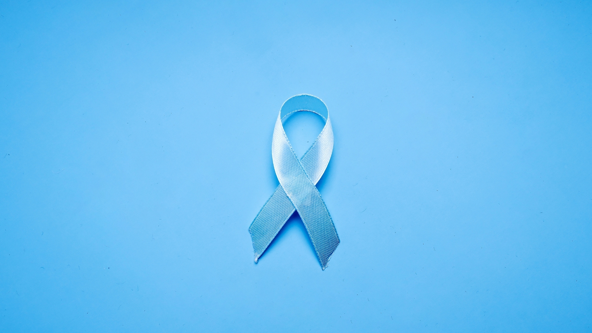 Blue ribbon on blue background