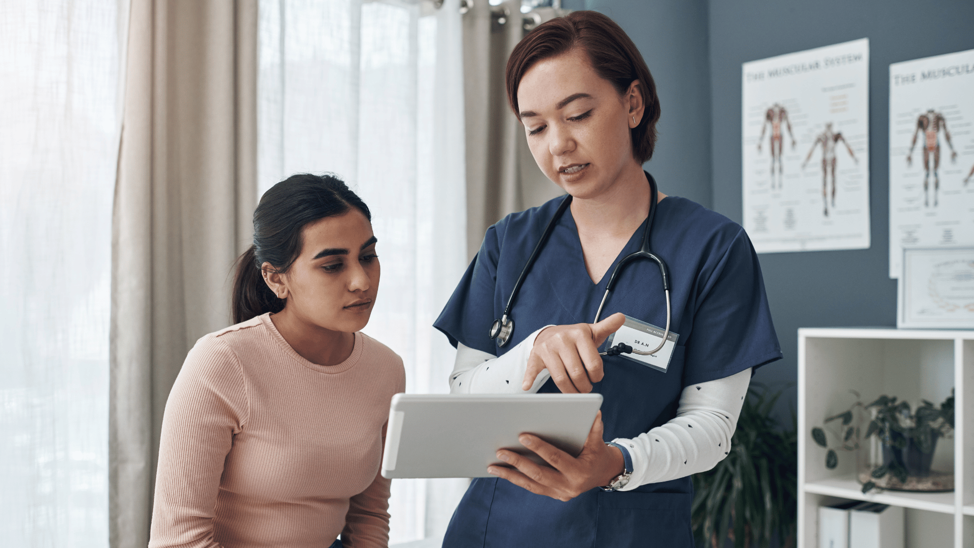Doctor chatting to patient showing document