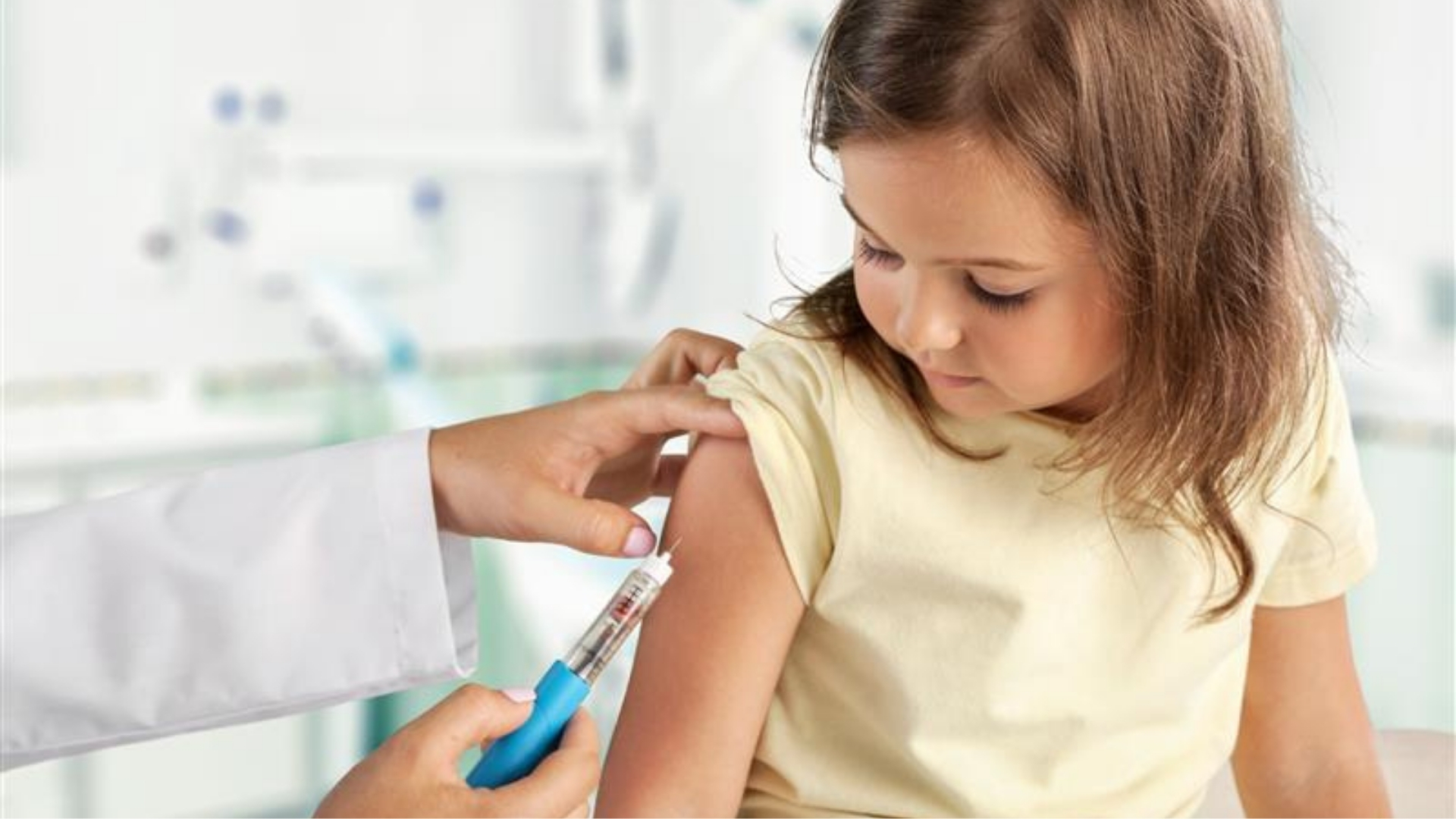 Girl child getting vaccinated