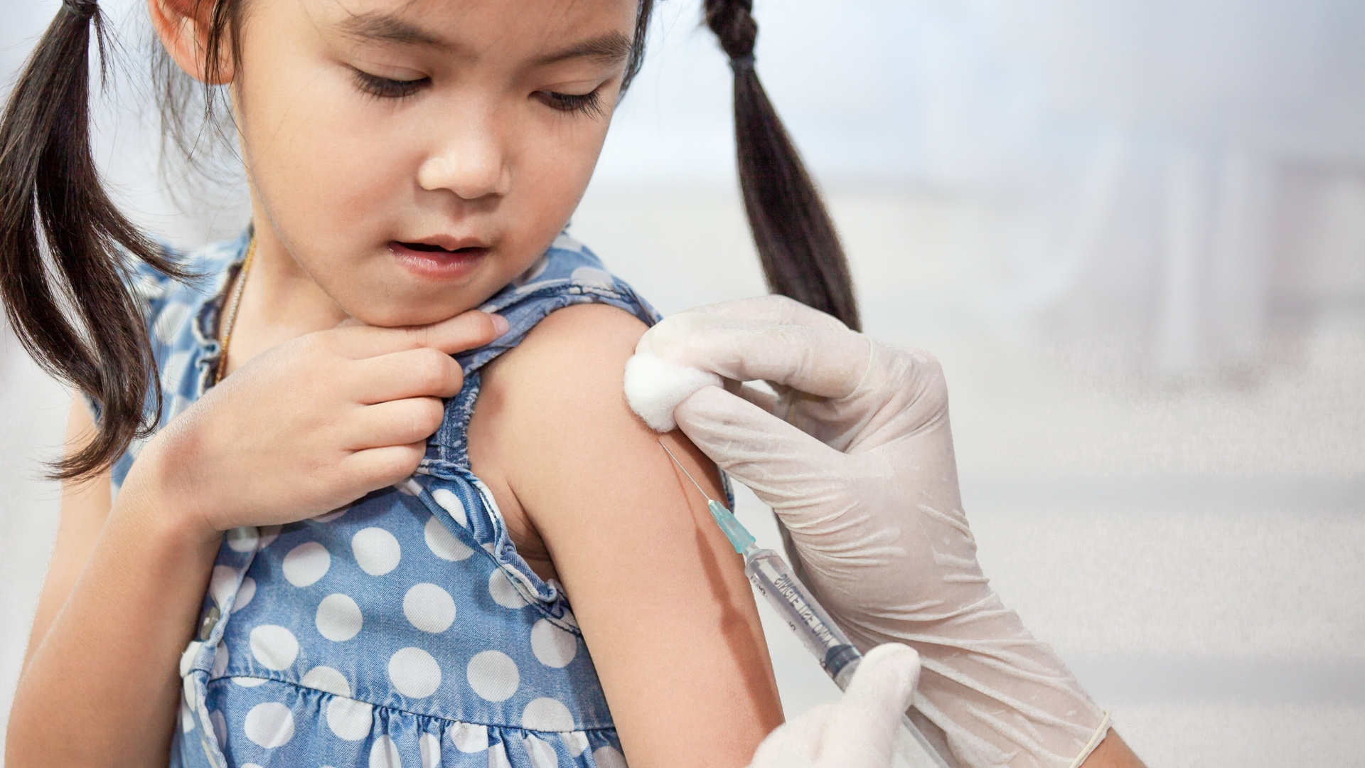 Girl child getting vaccinated
