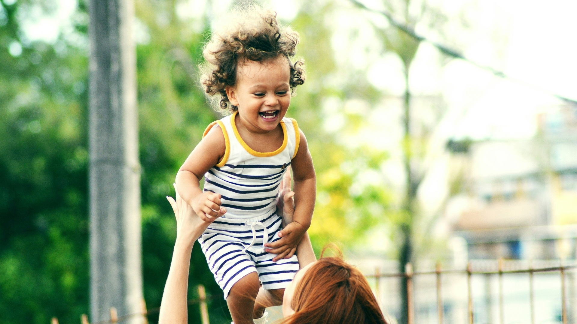Happy child playing with mom