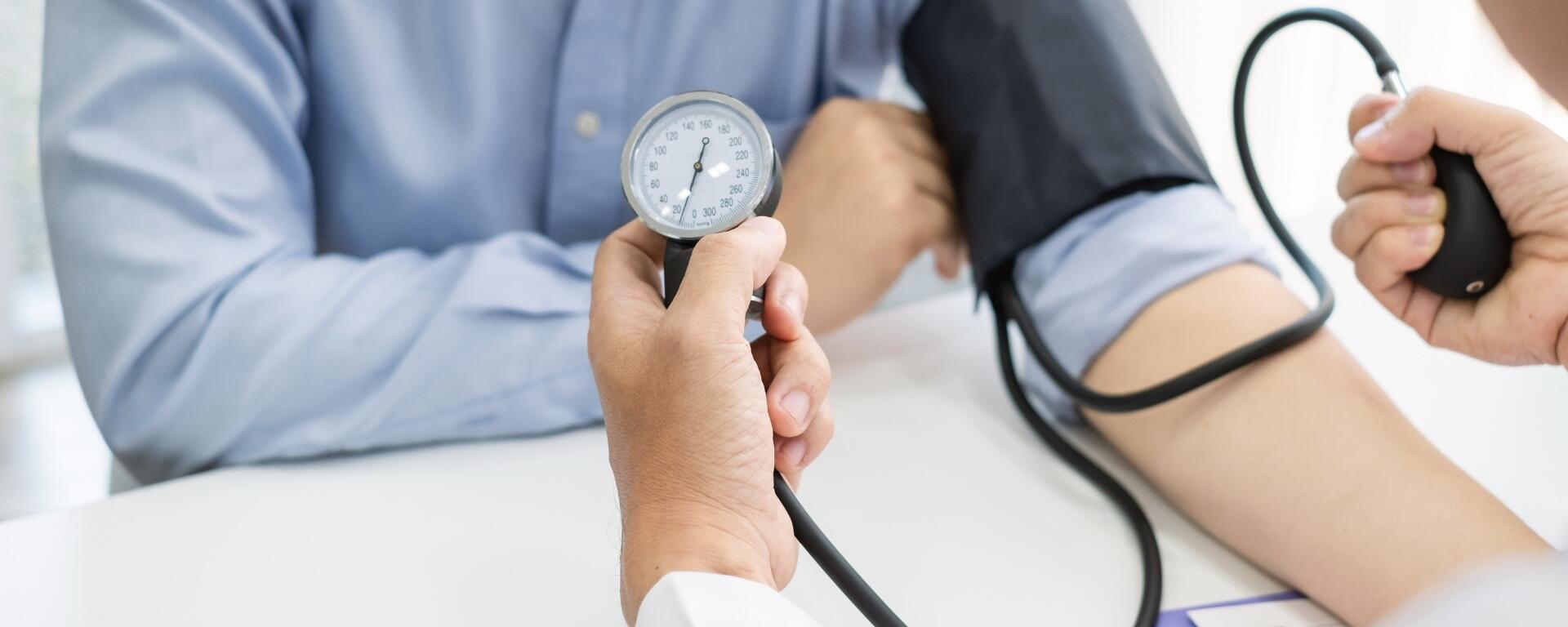 Male patient getting blood pressure taken
