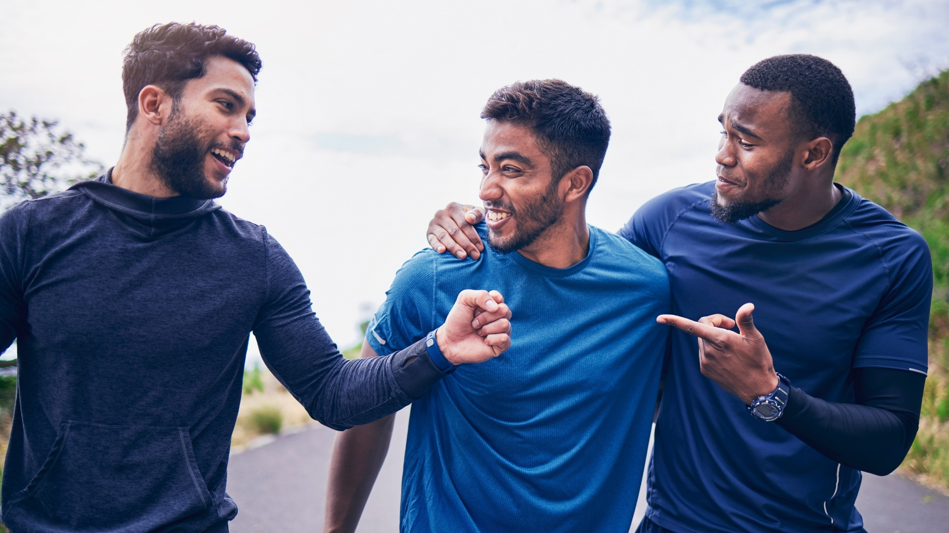Three men running