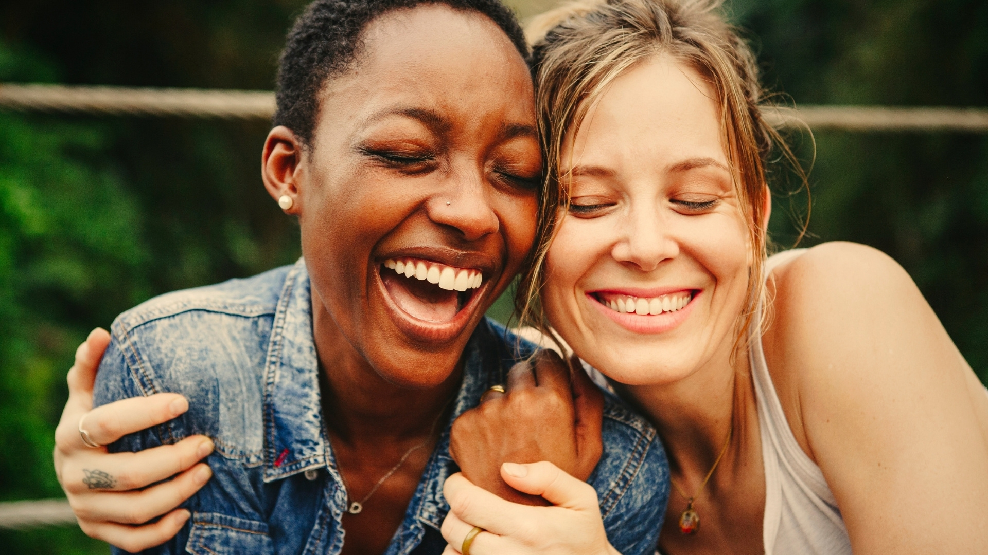 Two friends smiling supporting each other