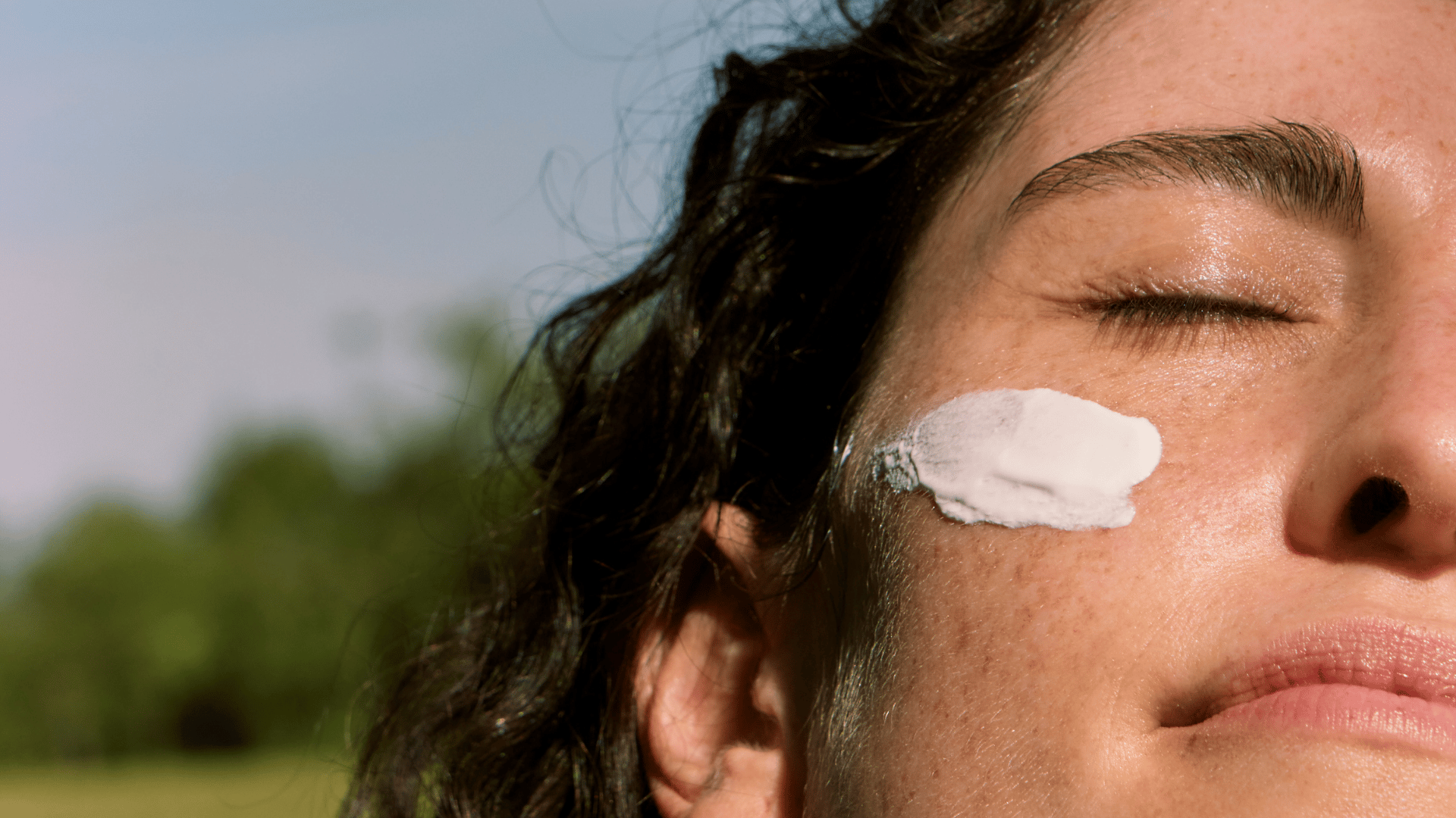 Woman with sunscreen on face
