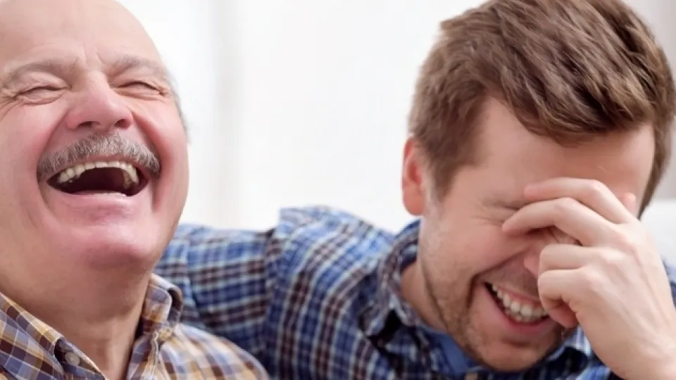 Father and son laughing - good mental health