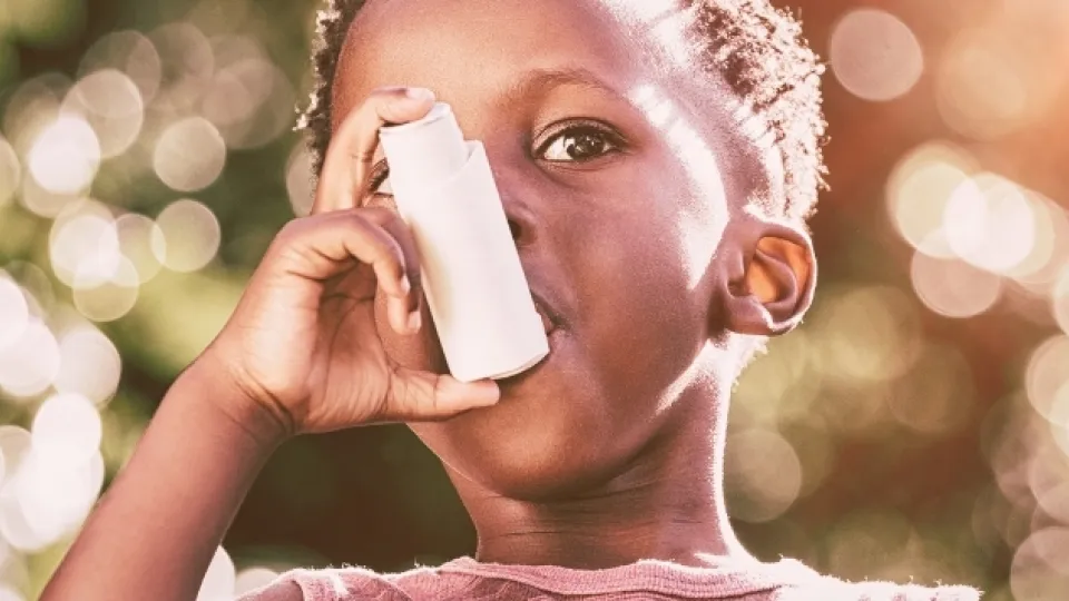 Boy with inhaler for asthma