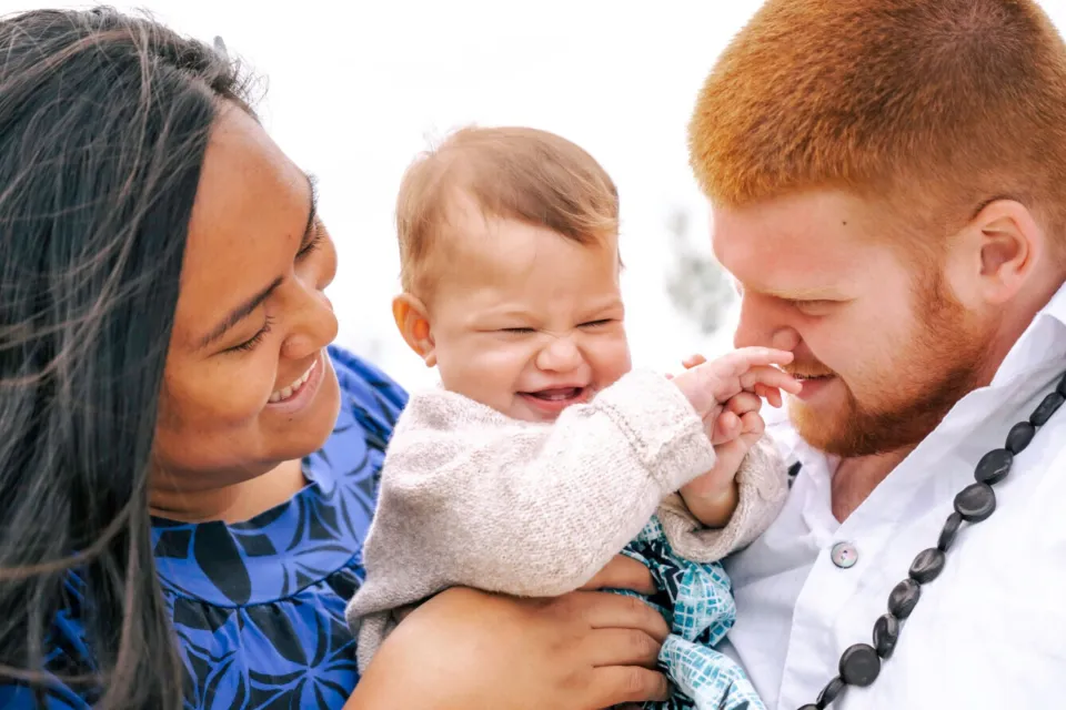 Mum & Dad cuddle baby, patients at The Doctors