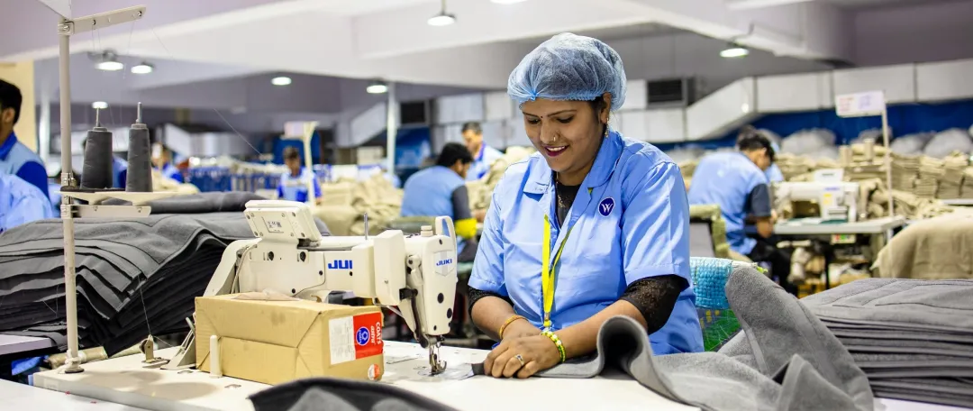 busy factory with workers at sewing machines